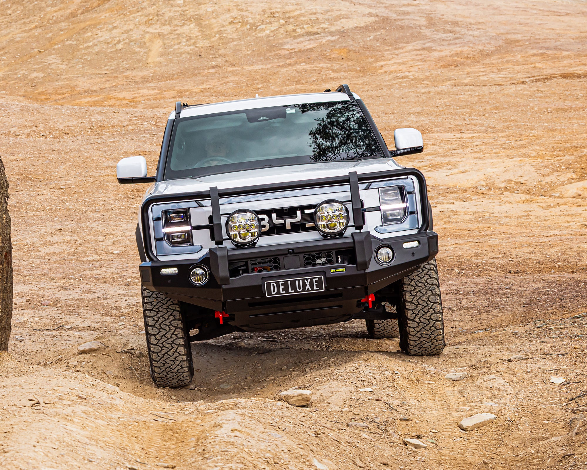 ironman 4x4 aluminium deluxe bull bar for byd shark 6 - driving up hill on 4x4 track