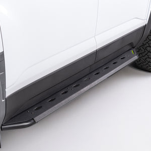 Steel side steps on a white byd shark 6 with a tire visible