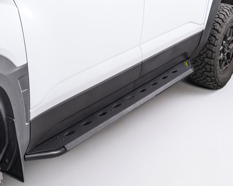 Steel side steps on a white byd shark 6 with a tire visible