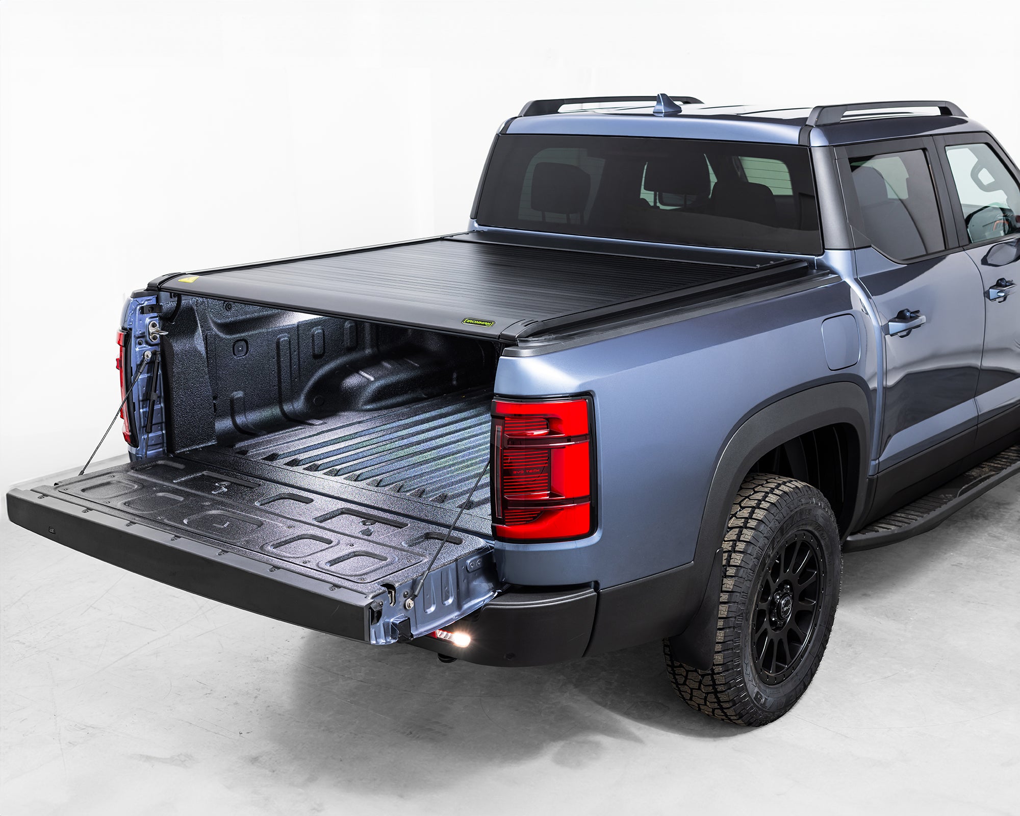 ironman 4x4 ute roller shutter for byd shark 6 34 view tailgate open