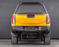 toyota hilux n90 2026 sunglow orange with ironman 4x4 raid aluminium ute canopy aluminium doors rear angle