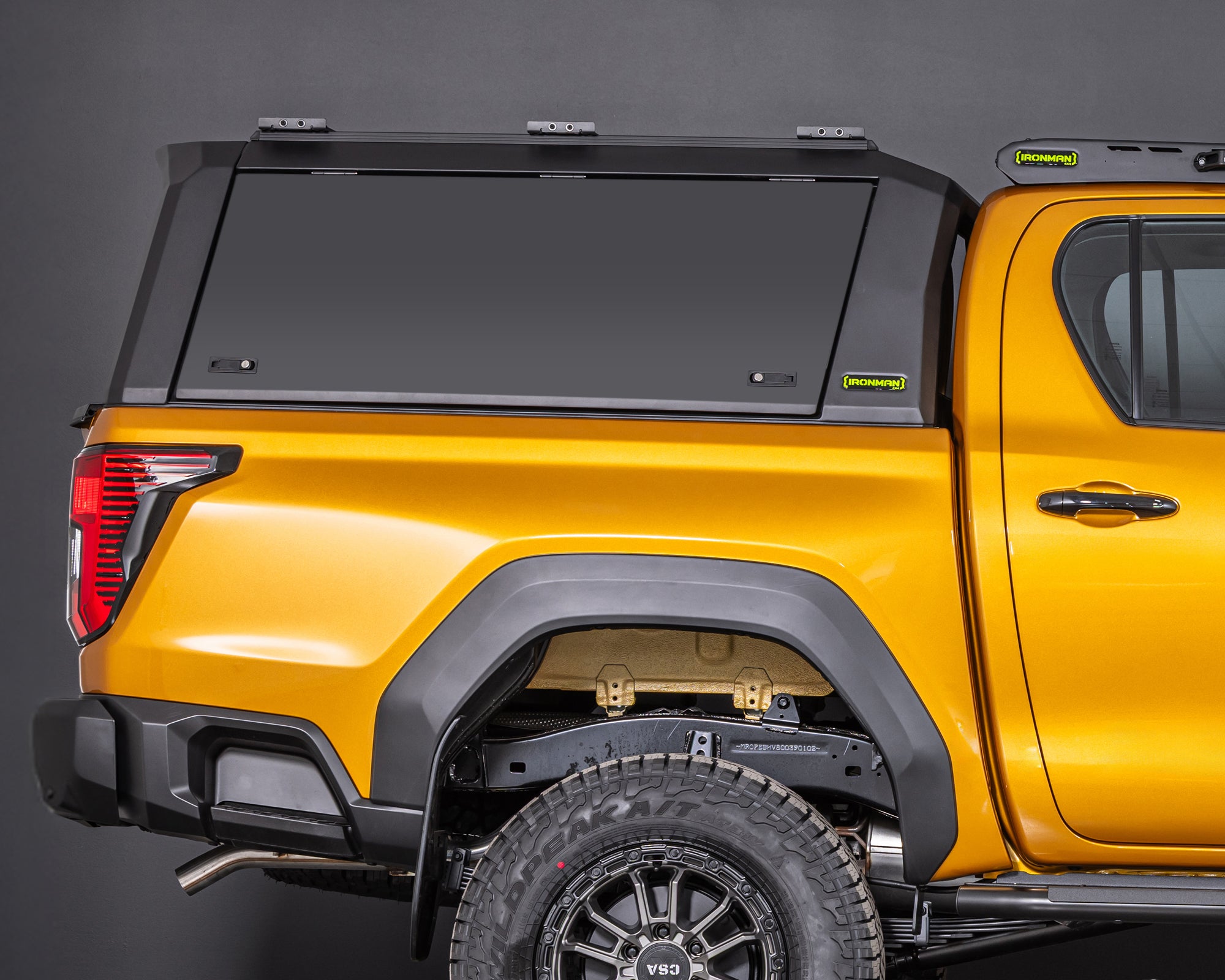 toyota hilux n90 2026 sunglow orange with ironman 4x4 raid aluminium ute canopy aluminium doors side profile